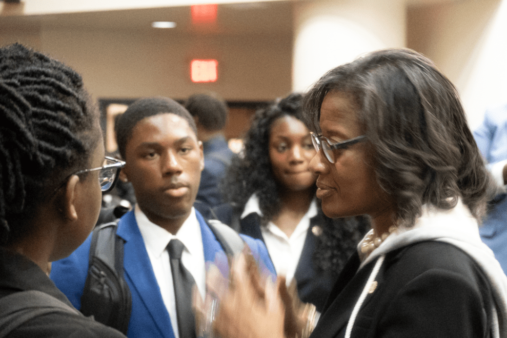 Dr. Hale speaking with students