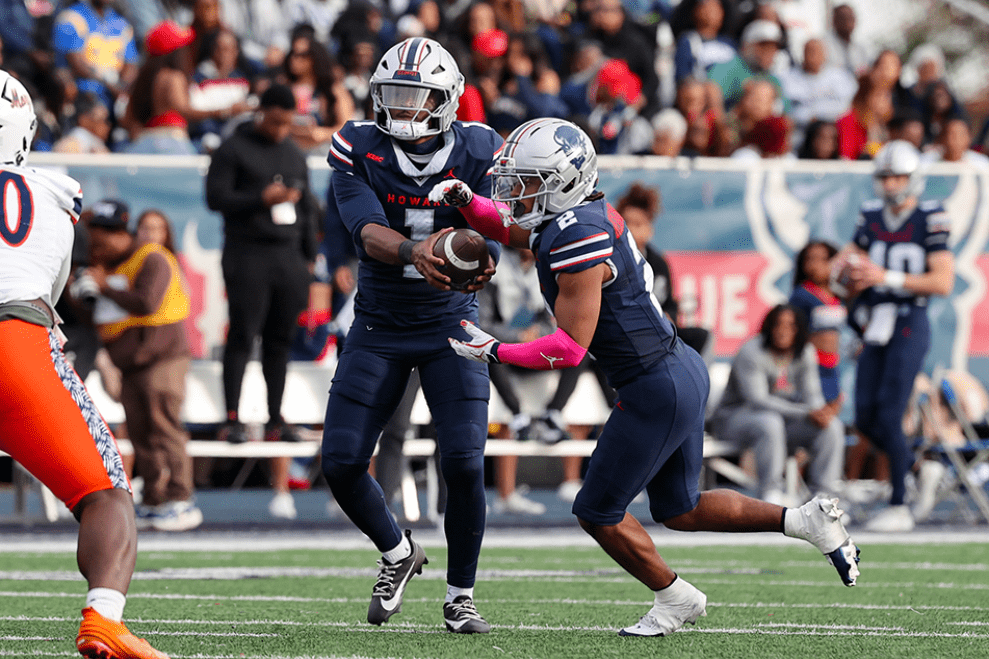 Howard football players on the field during homecoming game