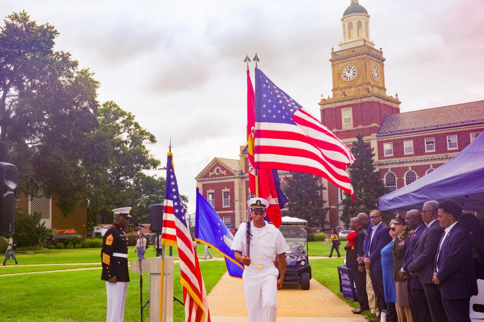 The Howard University Color Guard wearing military uniforms presenting the colors on The Yard