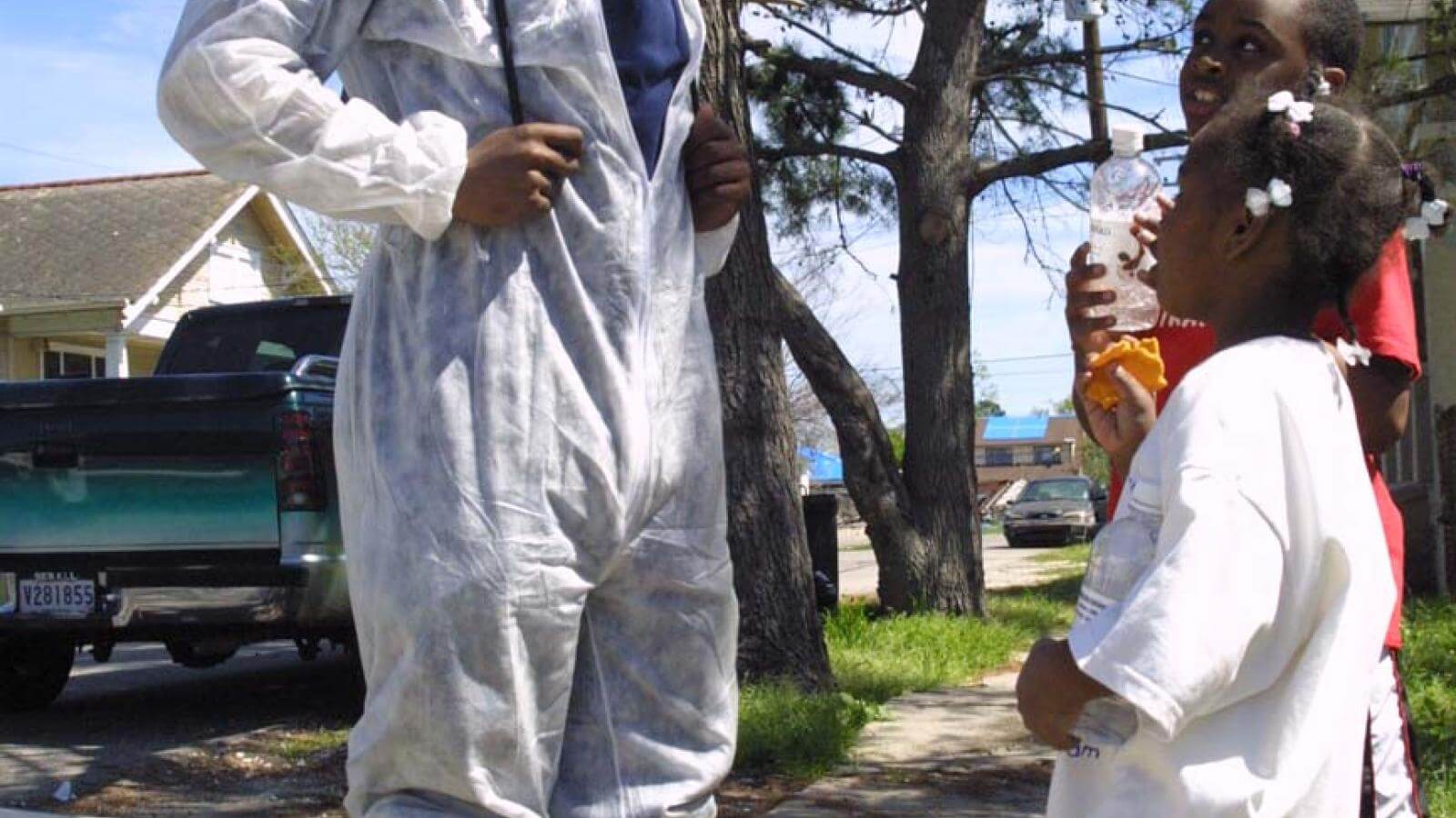 A Howard student volunteer talks with younger children in New Orleans after Katrina.