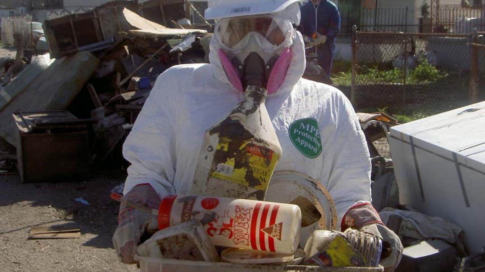 A Howard student gathers trash in New Orleans after Katrina.
