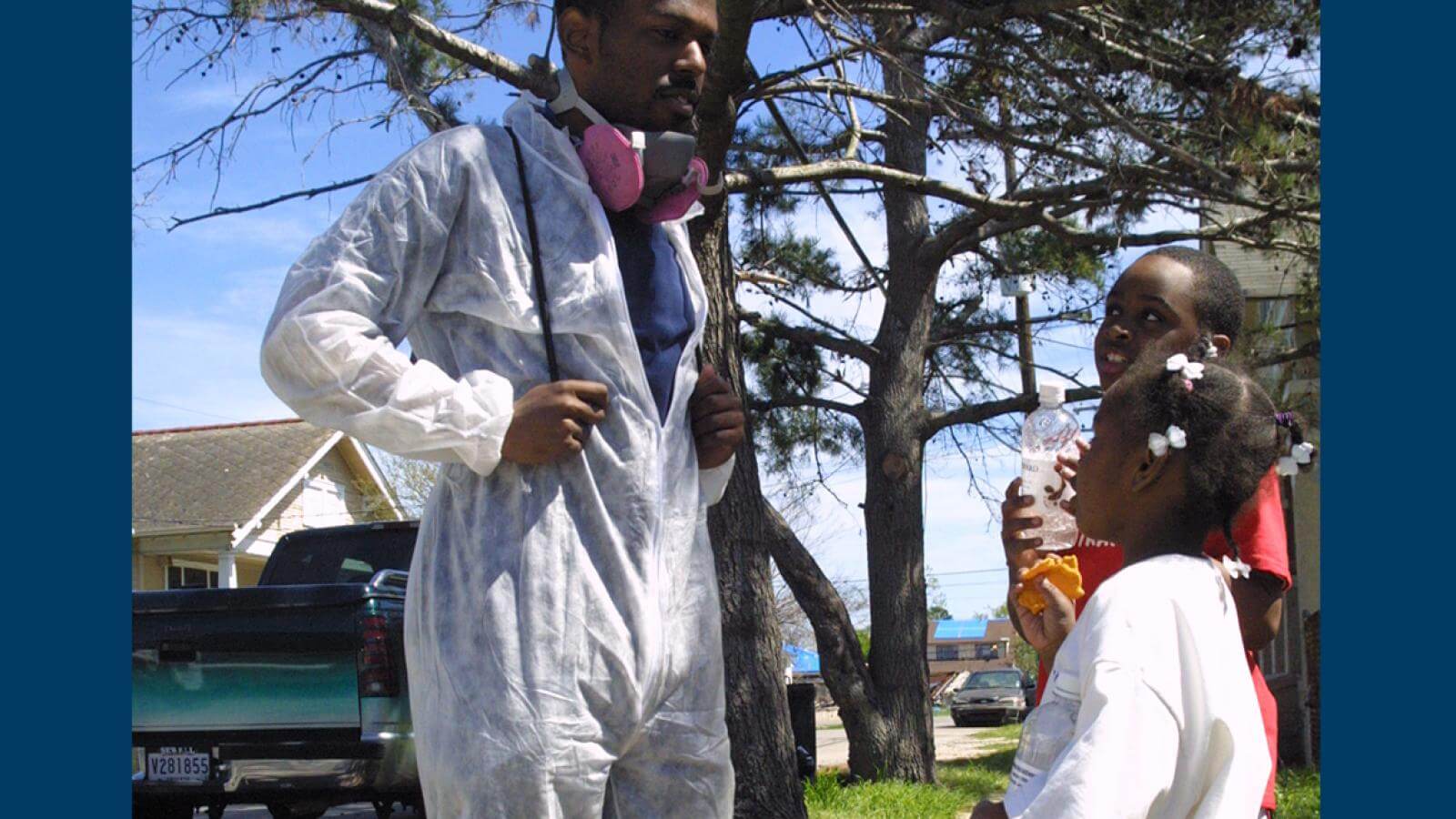 A Howard student volunteer speaks to young residents of a New Orleans neighborhood.
