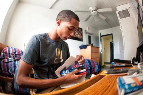 Student Moving Into Dorm Room