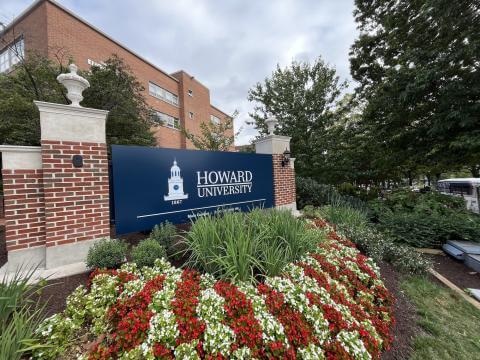 Howard University Sign surrounded by flowers on Georgia Avenue