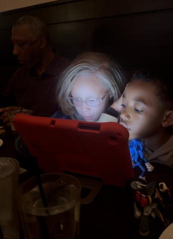 Two Children Using Screens