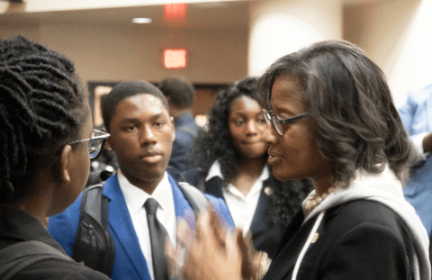 Dr. Hale speaking with students