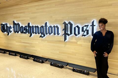 Zoe Cummings standing in front of the Washington Post sign