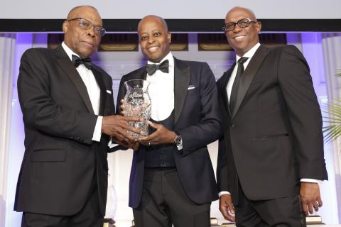 Dr. Frederick with AFUWI award