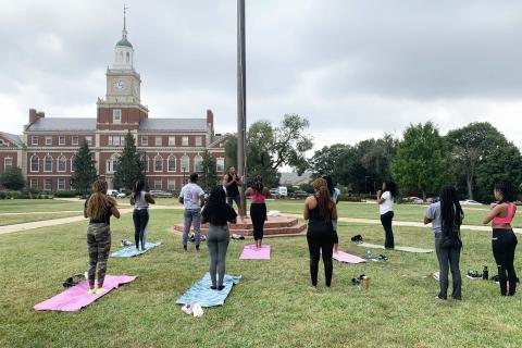 Yoga event happening on Howard University's campus grounds