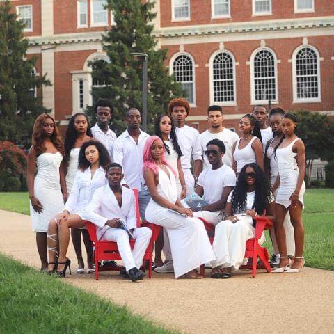 Models Inc. posed in The Yard wearing stylish white outfits