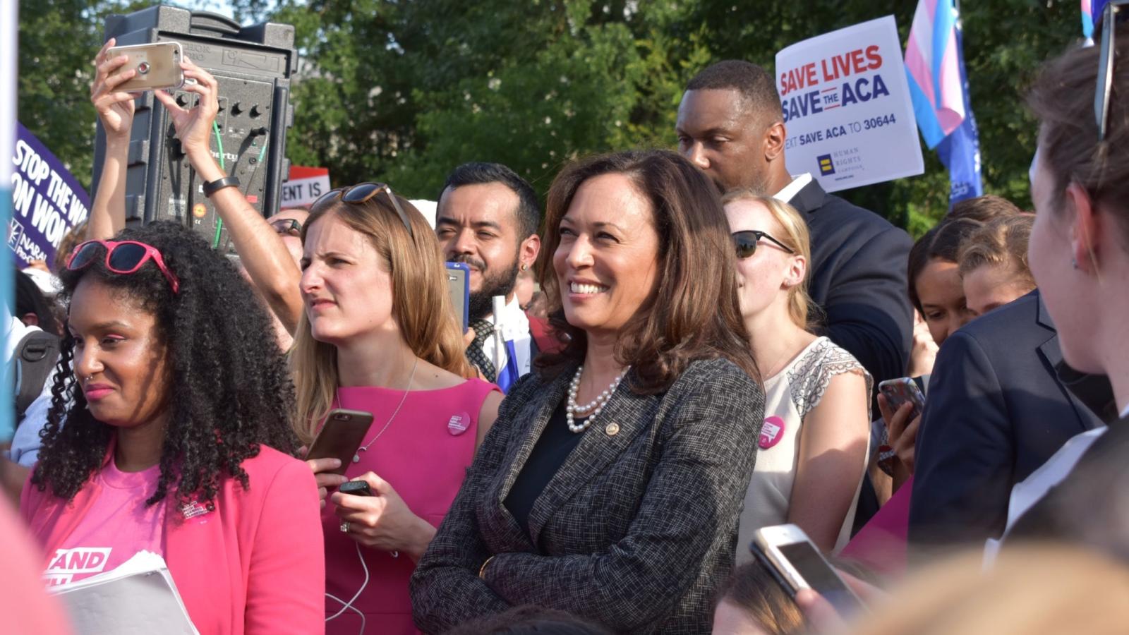 Kamala Harris in crowd of women with signs