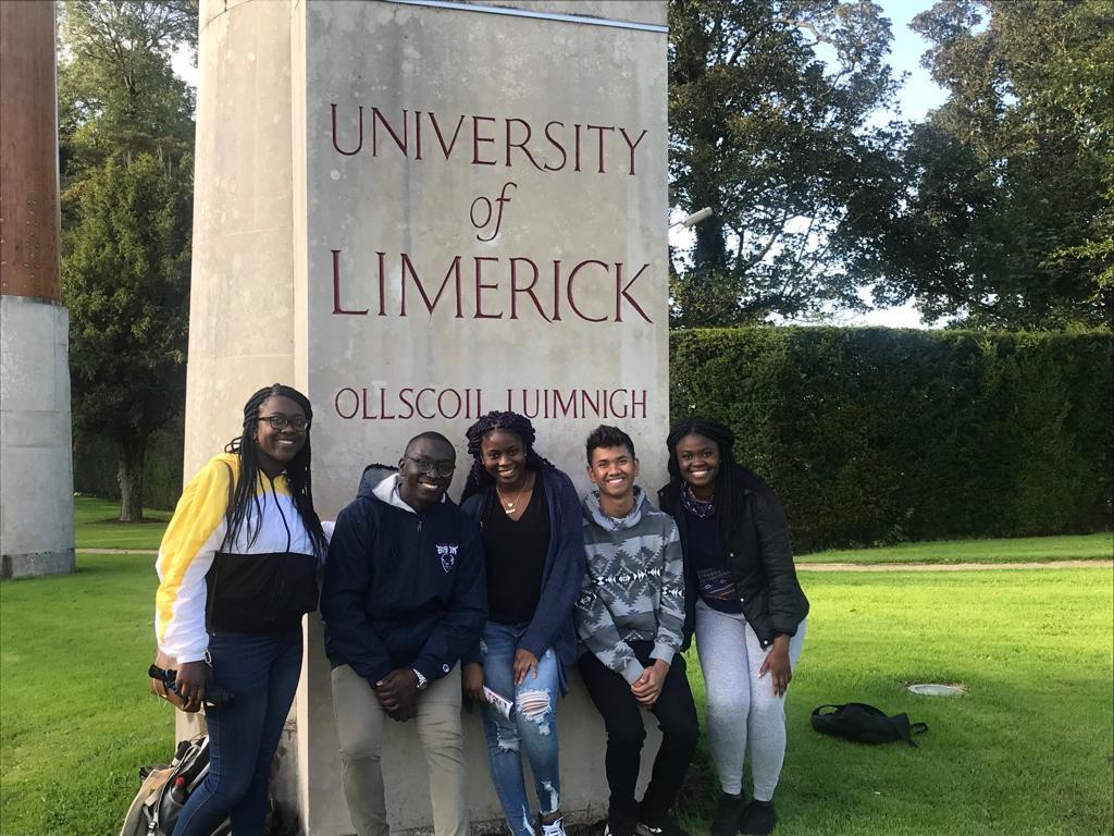 five students in front of University of Limerick sign