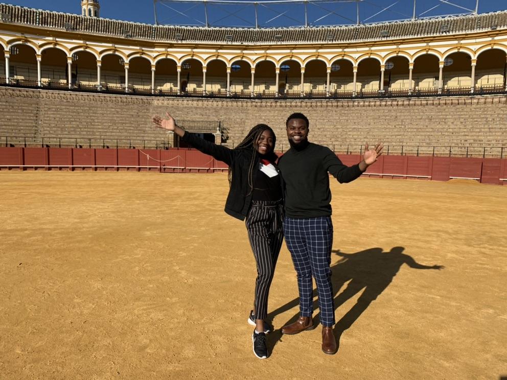 Two students in bullfight ring in Spain
