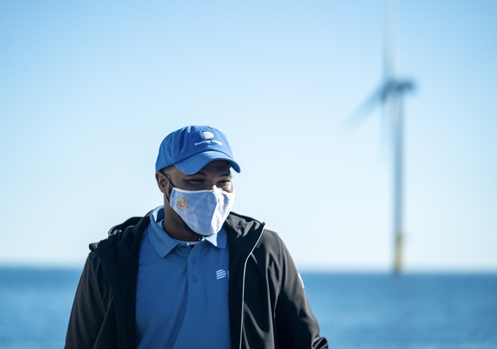 Lloyd Eley with wind turbine in back