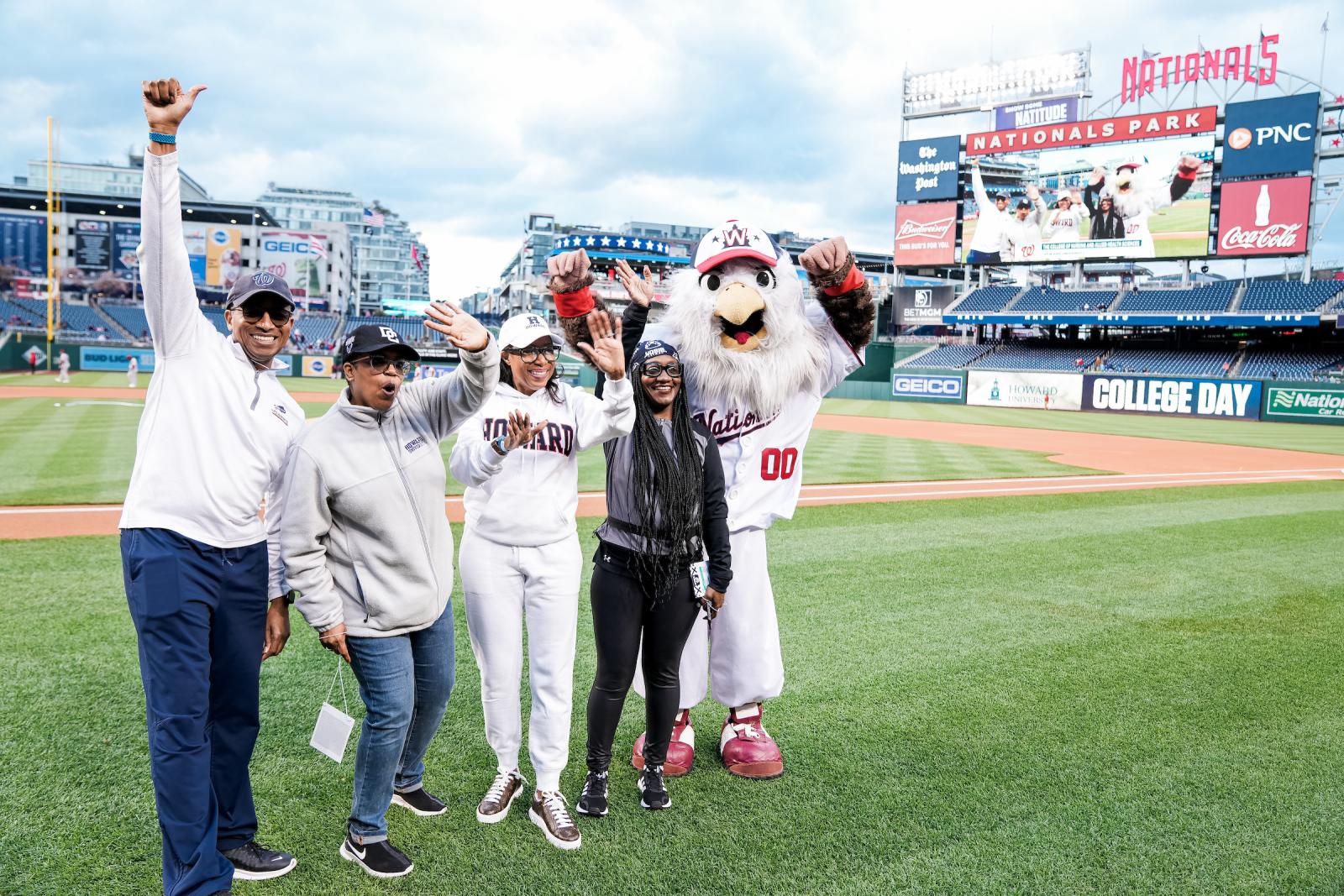 College of Nursing with Nationals mascots at Nationals Stadium