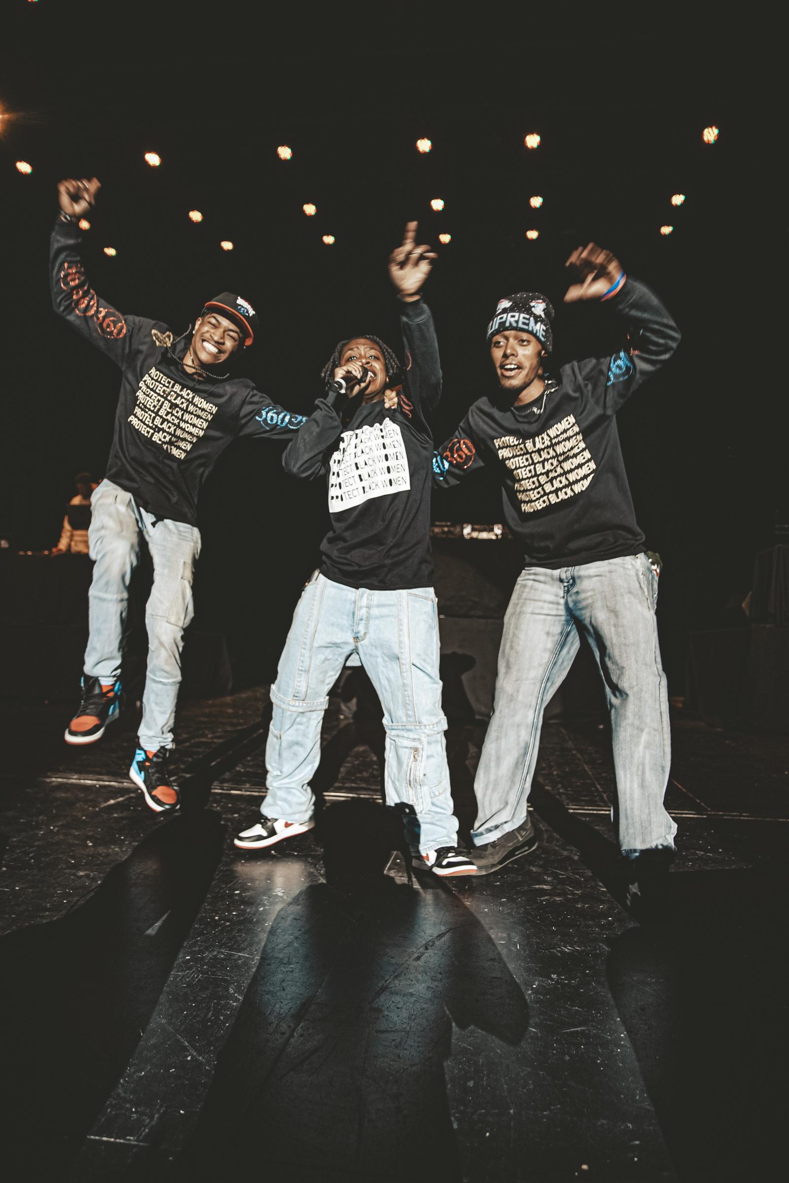 Three students perform on stage at Springfest concert