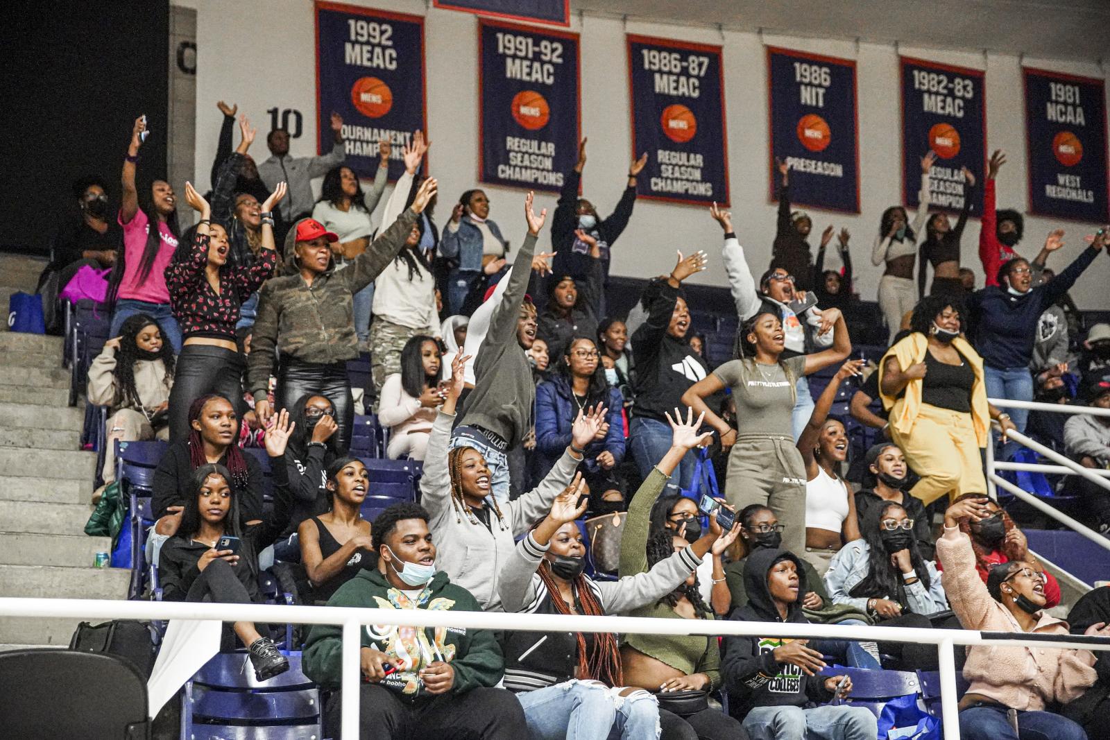 Students cheer at a basketball game