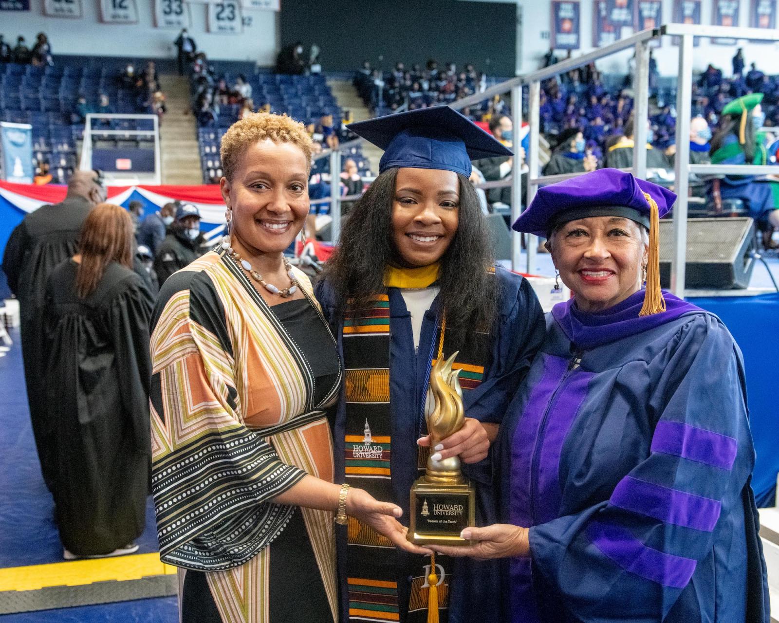 Dominique Jackson with her mother and grandmother at commencement