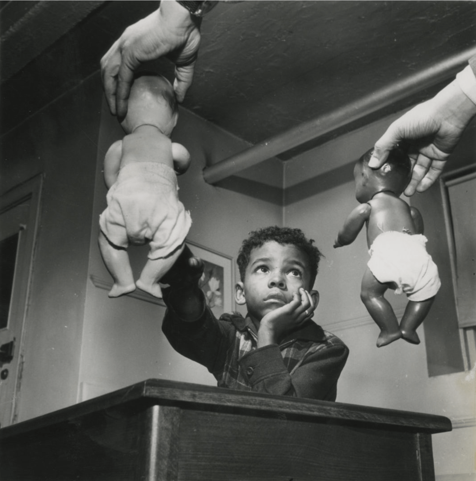Photo of a boy and the doll test by Gordon Parks