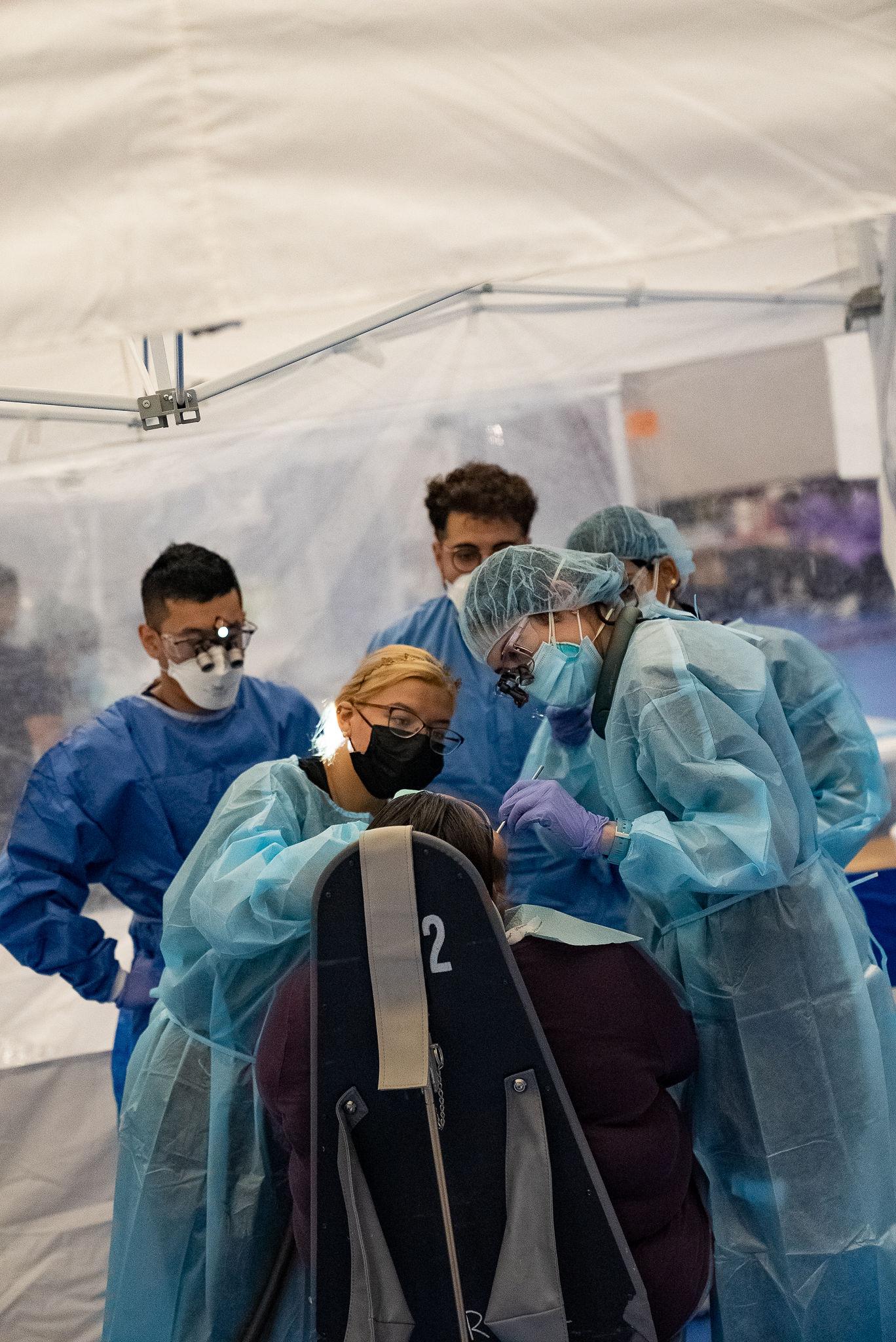 student examine dental patient