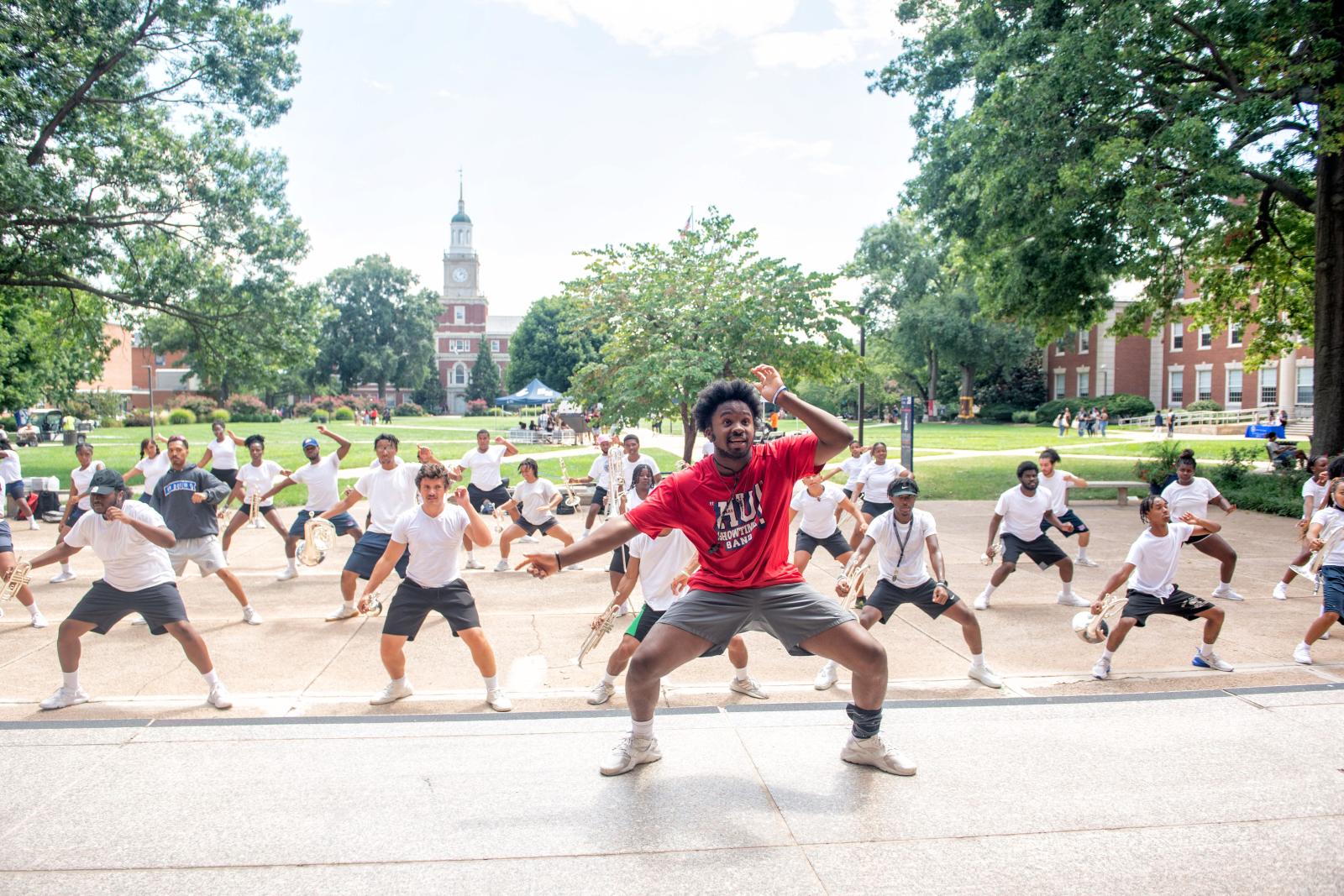 Drum Major, Keanu Powell, leads the Showtime Marching Band practice from the steps of the Chadwick A. Boseman College of Fine Arts Building.  -Justin D. Knight/Howard University