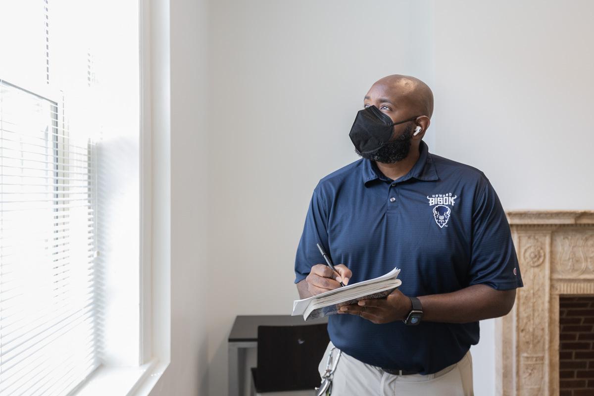 Howard staff inspects residence hall room