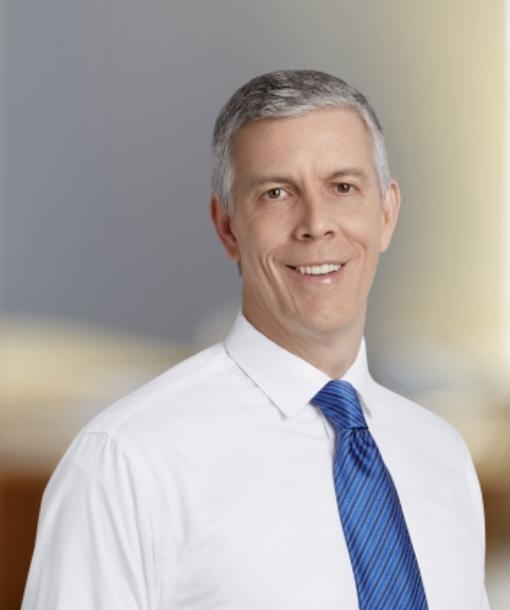 Arne Duncan with White Shirt and Blue Tie