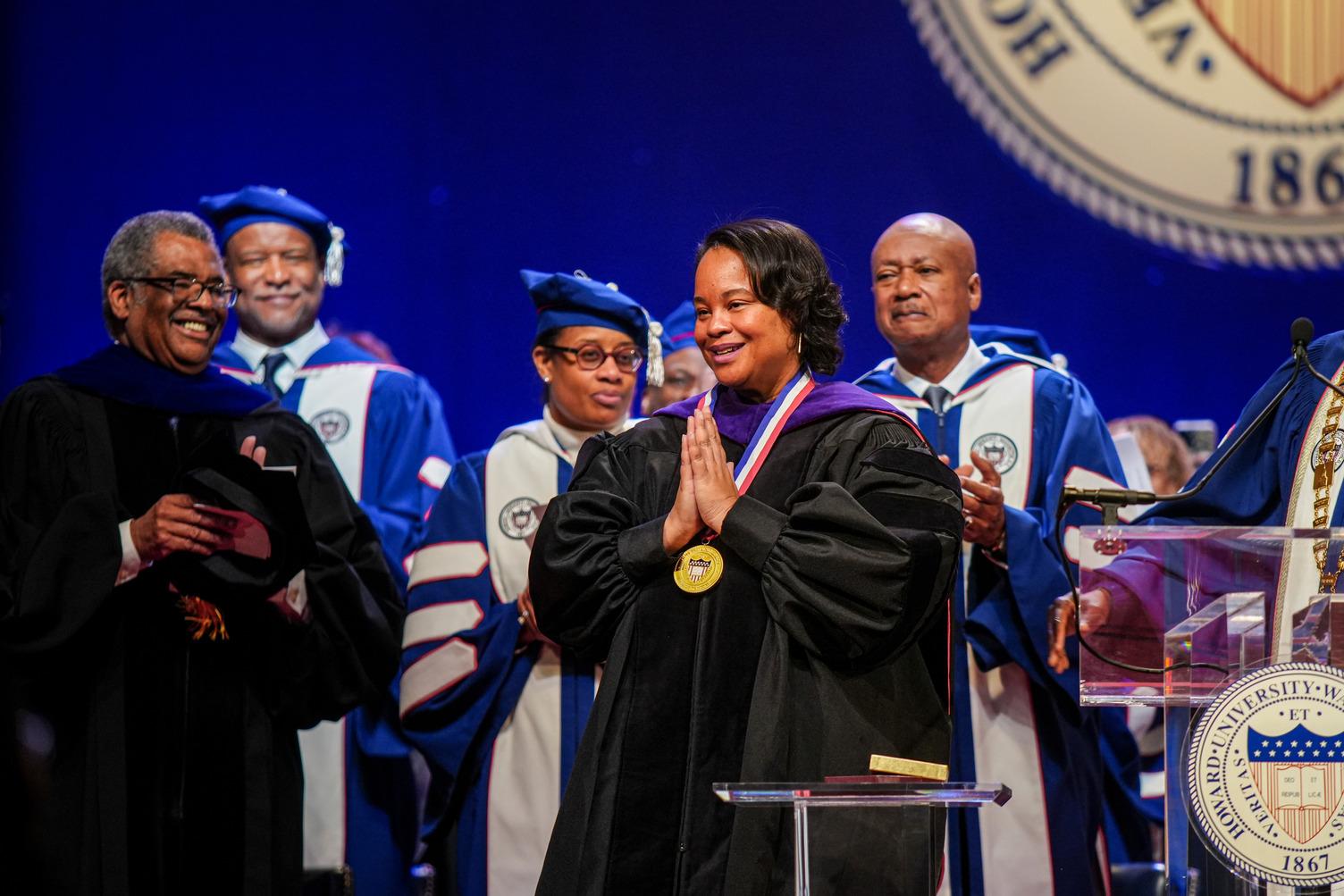 Howard School of Law Dean Danielle R. Holley takes in the standing ovation and her surprise reception of the Presidential Medal Award, which lauds members of the Howard community who embody truth and service beyond their roles.