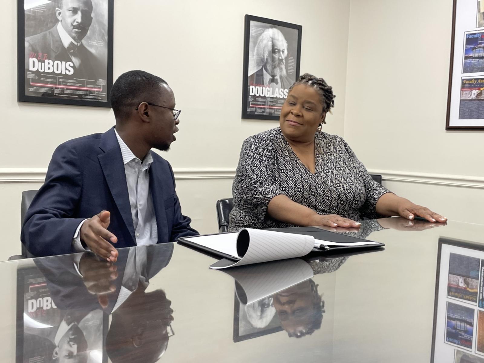 Melanie Carter, Ph.D., sits with HBCU Center Fellow Magana Kabugi, Ph.D. to discuss ideas surrounding his research work. (Source: HBCU Center for Research, Leadership, and Policy)