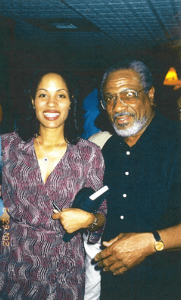 Carpenter-Rock posing with artist and gallery owner Norman Parish II.  “I worked at his gallery, Parish Gallery in Georgetown, while I was a student at Howard.”  Carpenter-Rock said.