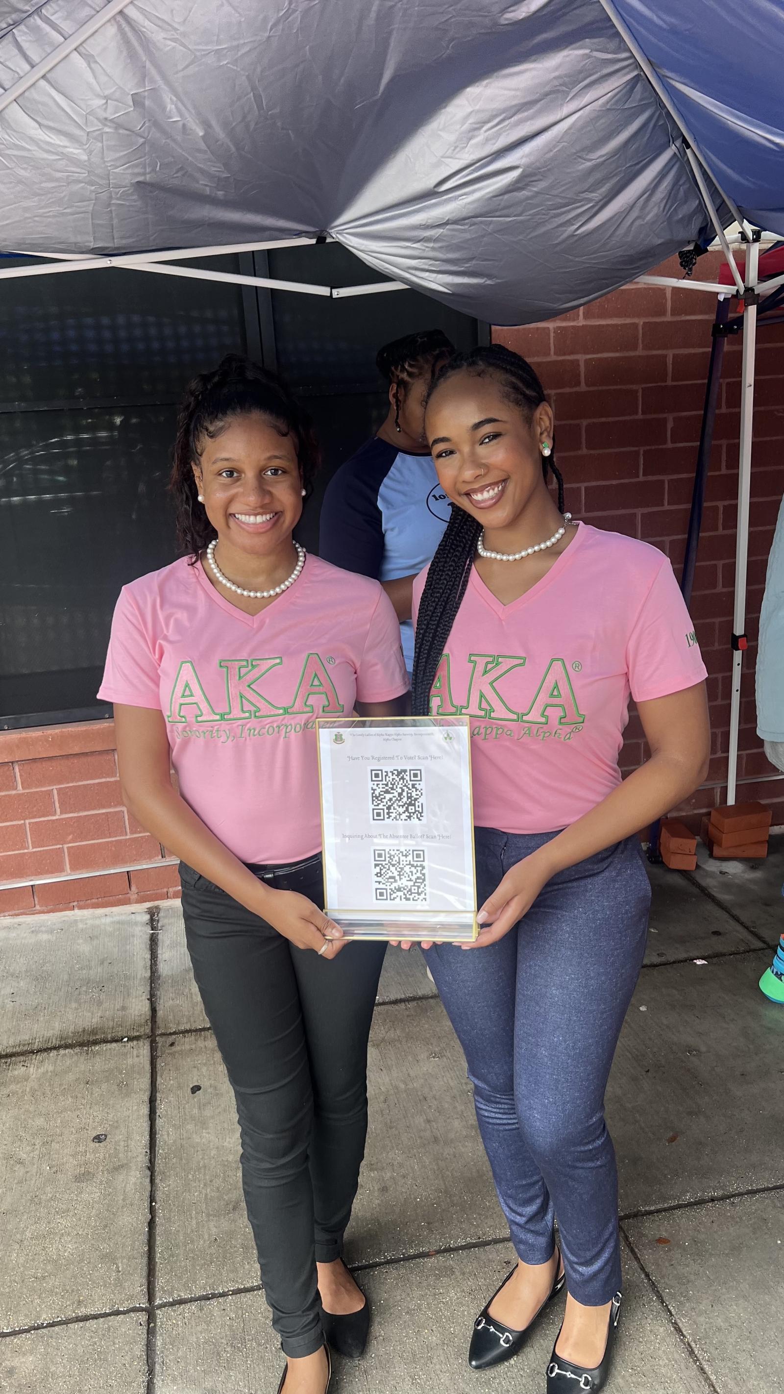 Using QR codes during Move-In Day, Alpha Kappa Alpha Sorority Inc. Alpha chapter members Jolie Fuller and Trinity Kinslow inquired about voter registration as many first-year students will be first-time voters in the 2024 presidential election. (Photographer: Amber D. Dodd) 