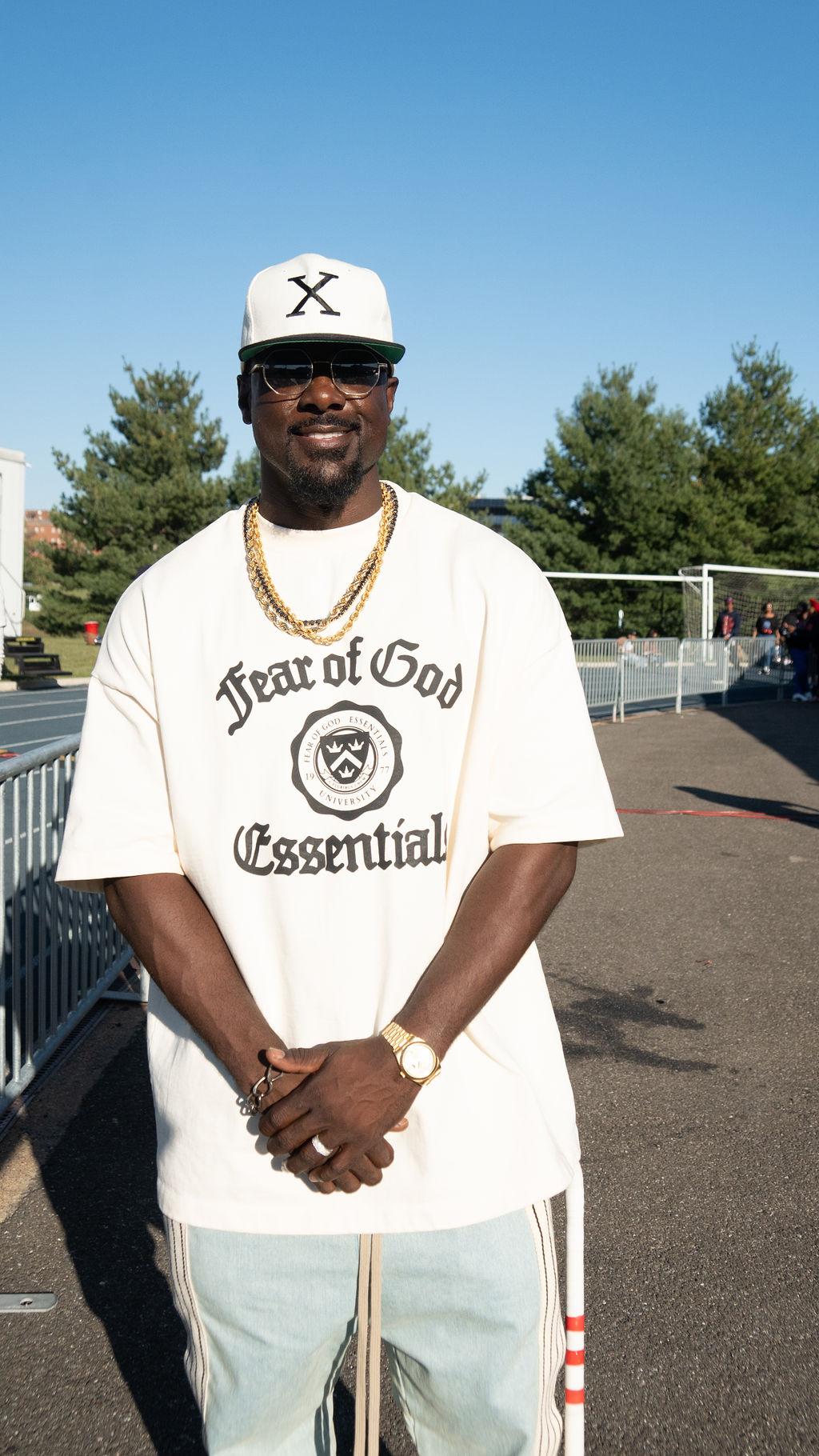 Actress Lance Gross (B.A. ’03) attends the Homecoming centennial football game at Greene stadium. 