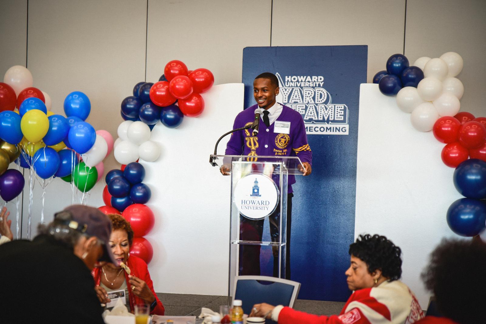 Omega Psi Phi’s Basileus Preston Jones delivers greetings and chapter updates during the Divine Nine’s homecoming brunch hosted by the Office of Annual Giving.  