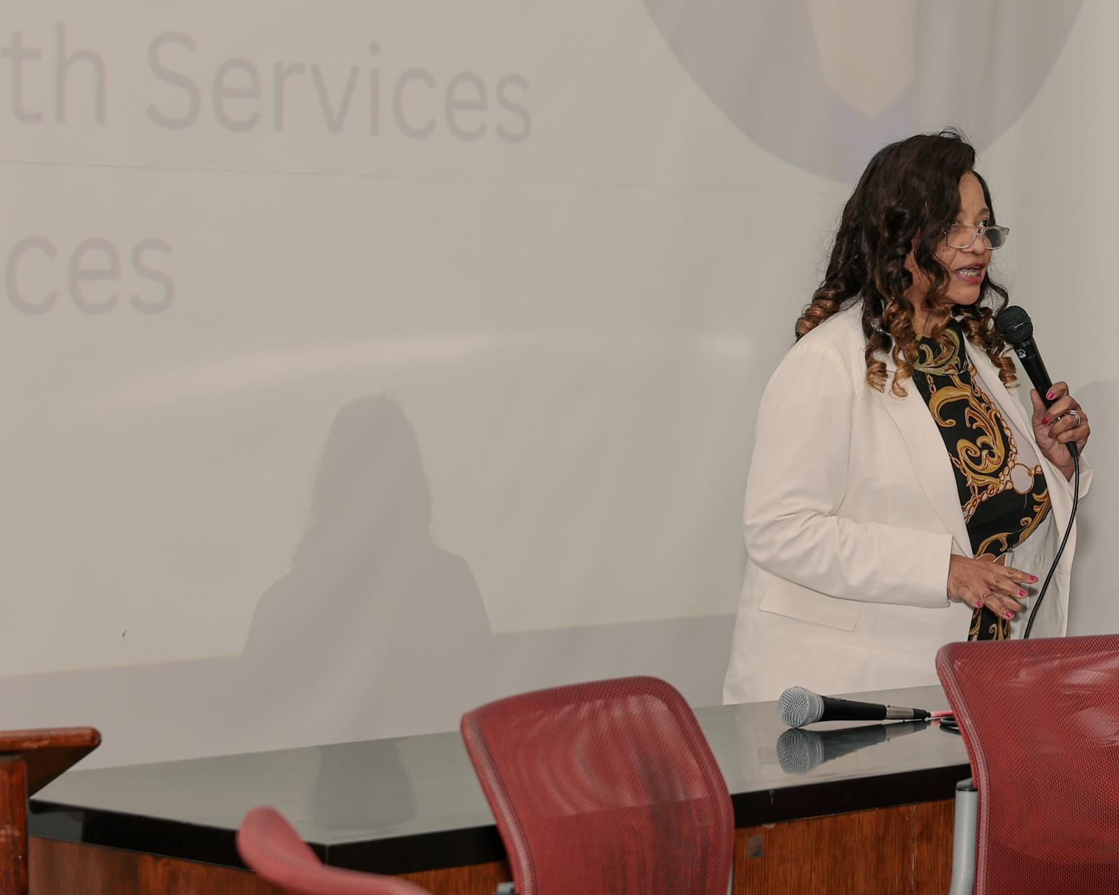 Que English, director of the Center for Faith-Based and Neighborhood Partnerships for the U.S. Department of Health and Human Services (HHS), spoke before the panel began about the offering of her center. (Source: Keenon Perry BA ’03)