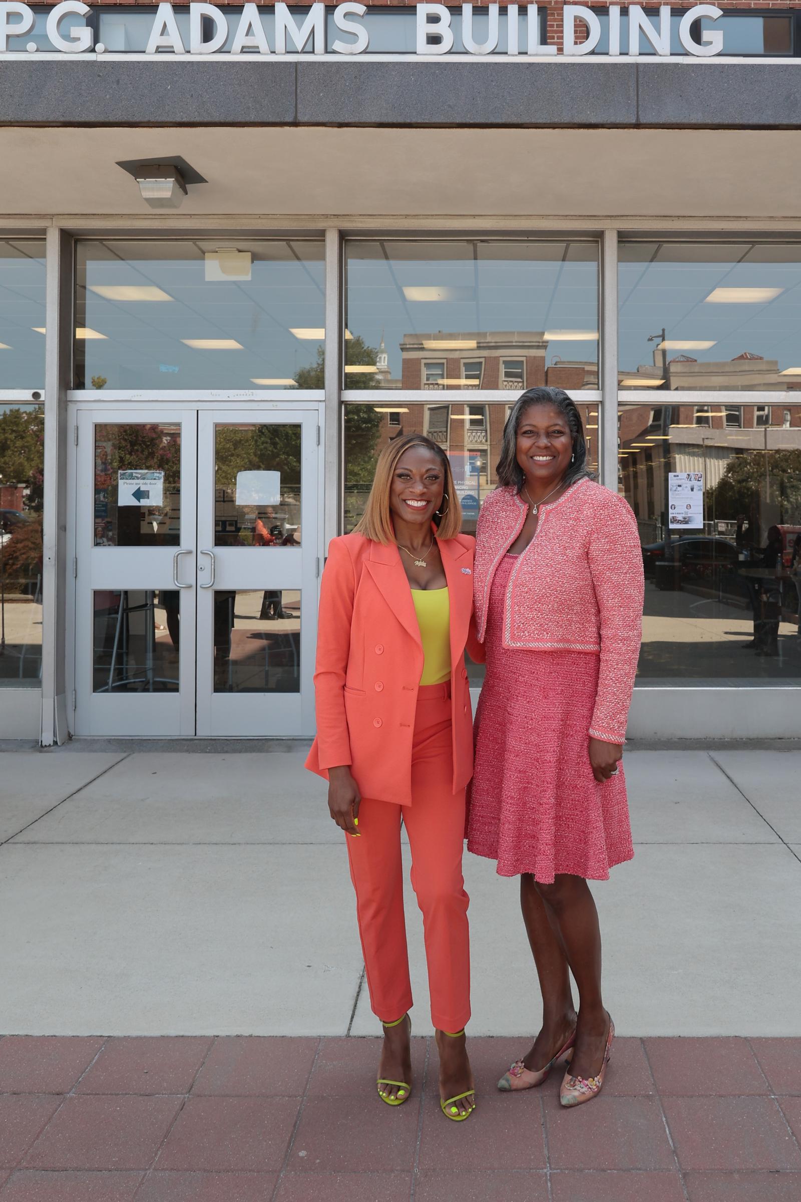 Angelina Spicer (BFA ’03) poses with Howard University College of Medicine Dean Andrea Hayes Dixon, MD, FACS outside of the University College of Medicine Numa Adams Building. (Source: Keenon Perry)  