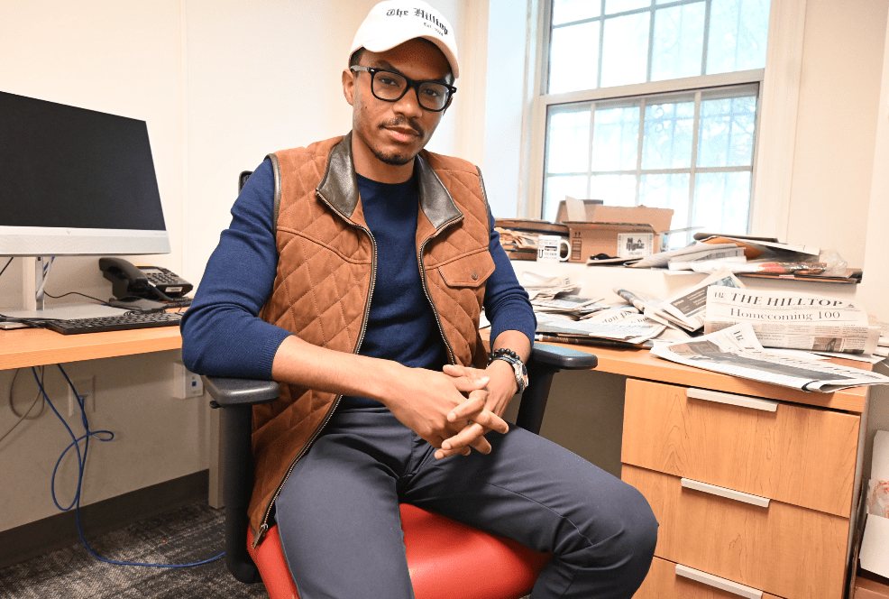 JD in front of his desk