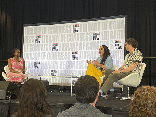 Jackson and Tremblay on stage during a panel