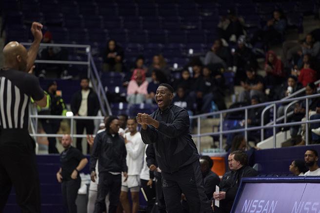 Howard University head coach Kenny Blakeney fires up his players from the sideline at Burr Gymnasium.