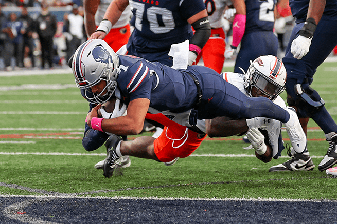 Howard football player scoring touchdown during homecoming