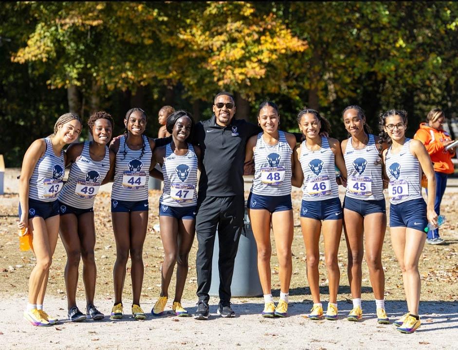 Head Cross Country Coach Morgan with the Women's Cross Country Team