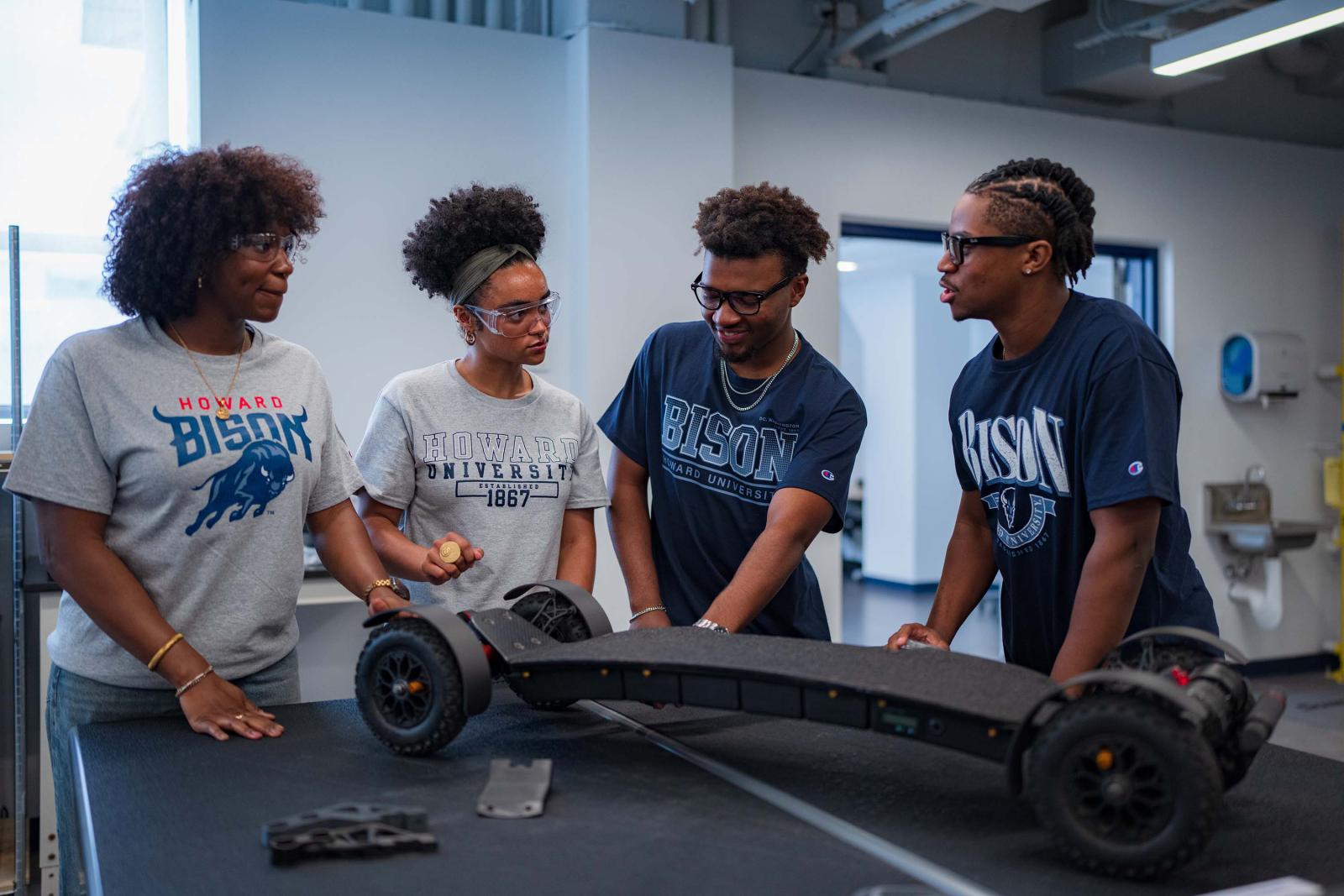 Students with Creations in Makerspace 