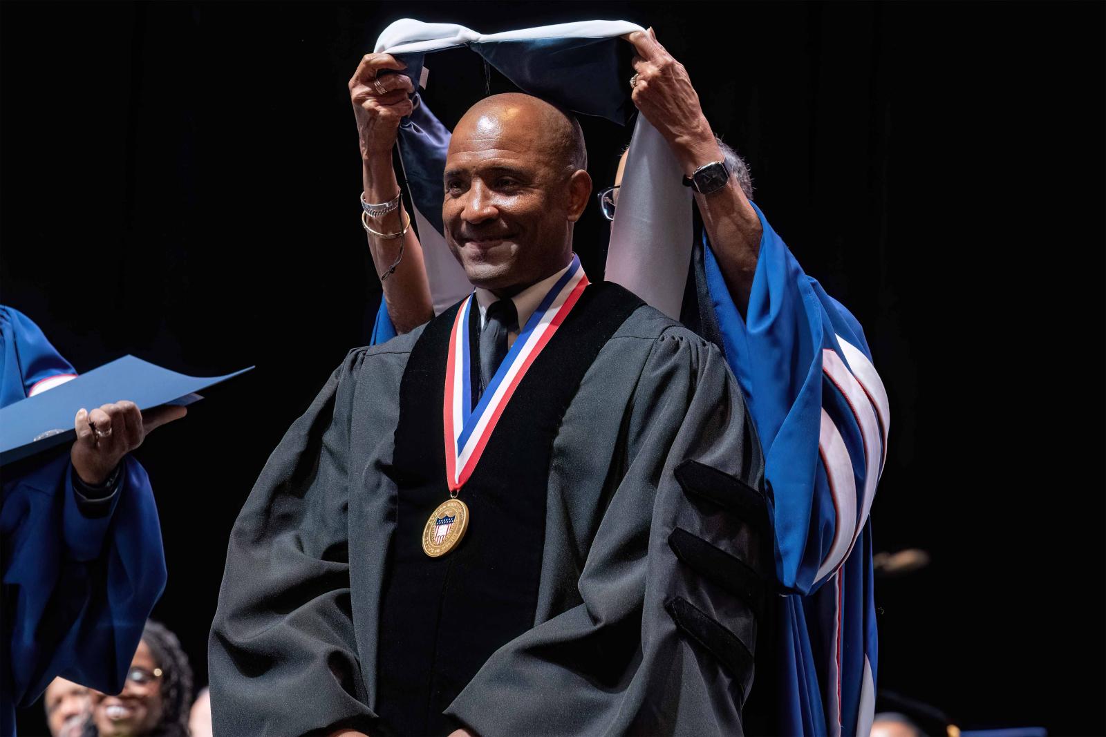 Victor Glover receiving honorary degree from Howard University