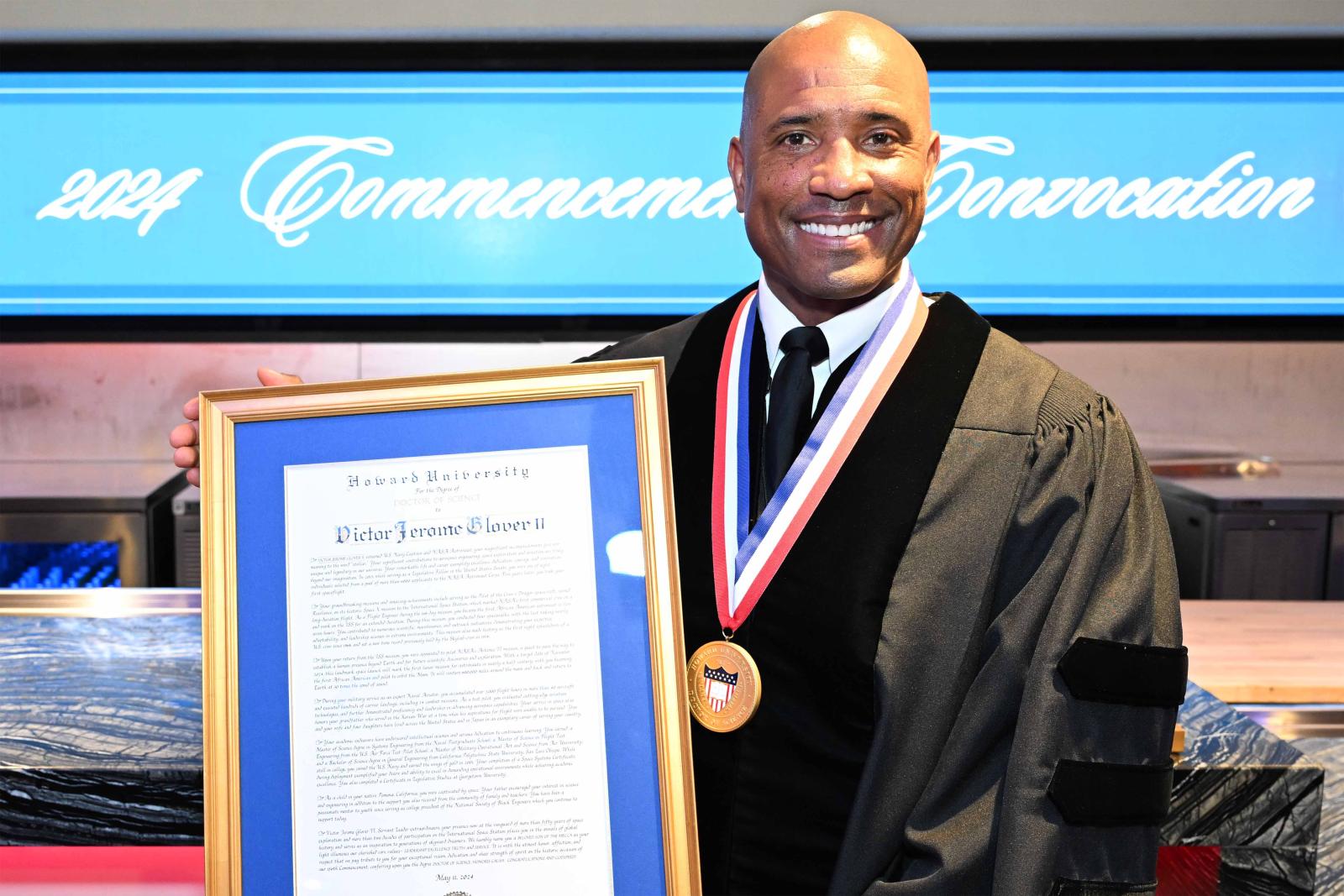 Victor Glover receiving honorary degree from Howard University