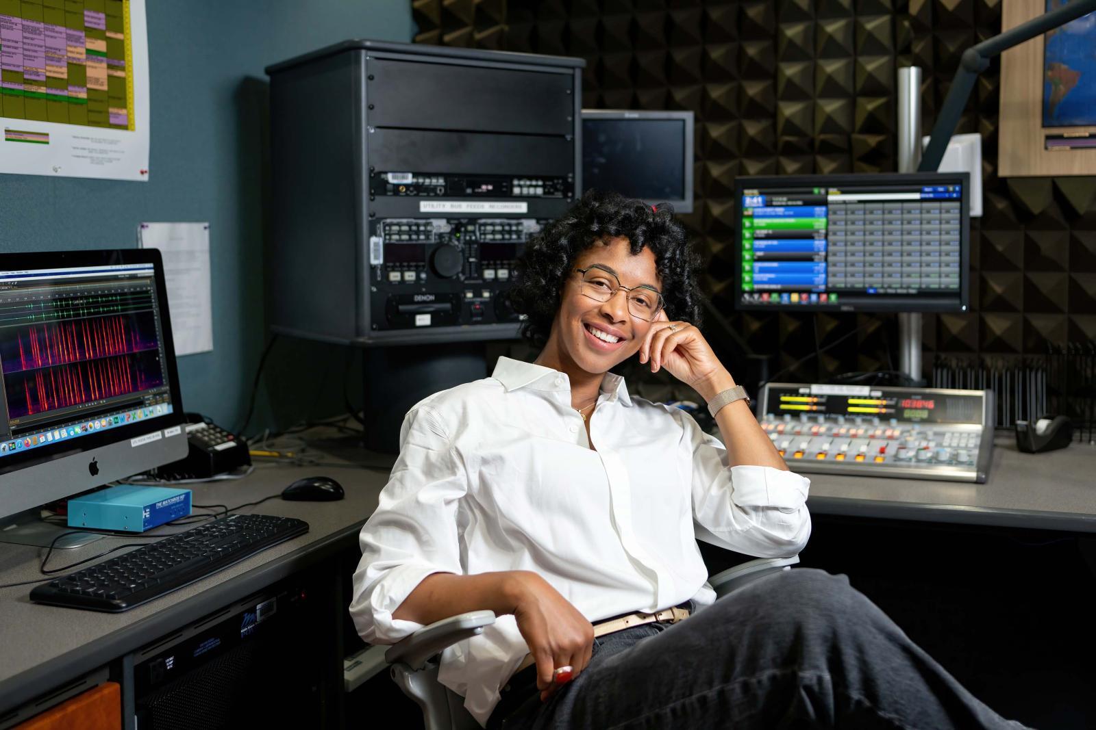 Carolyn Malachi sitting in her workspace