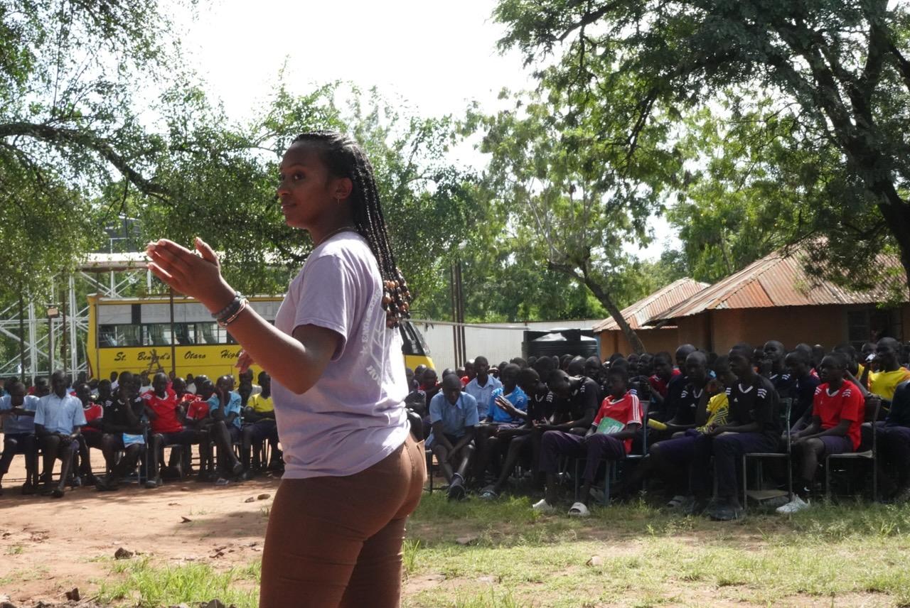 Monica Maya talks to community members in Kenya