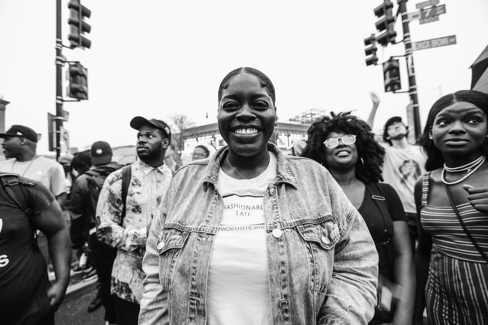 a Black and white photo of Julien Broomfield outside at a protest in DC