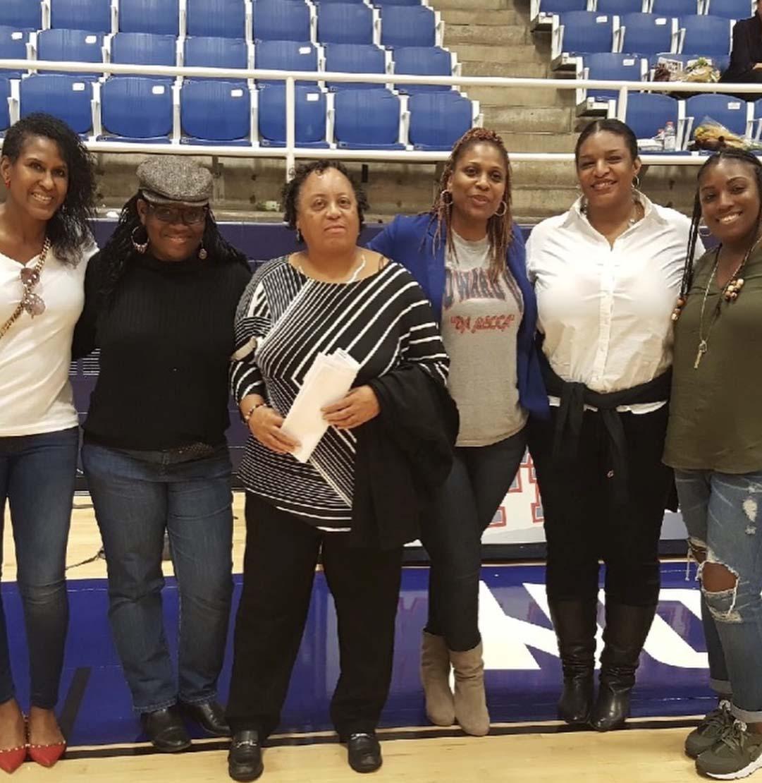 Linda Spencer and former members of Howard Volleyball team