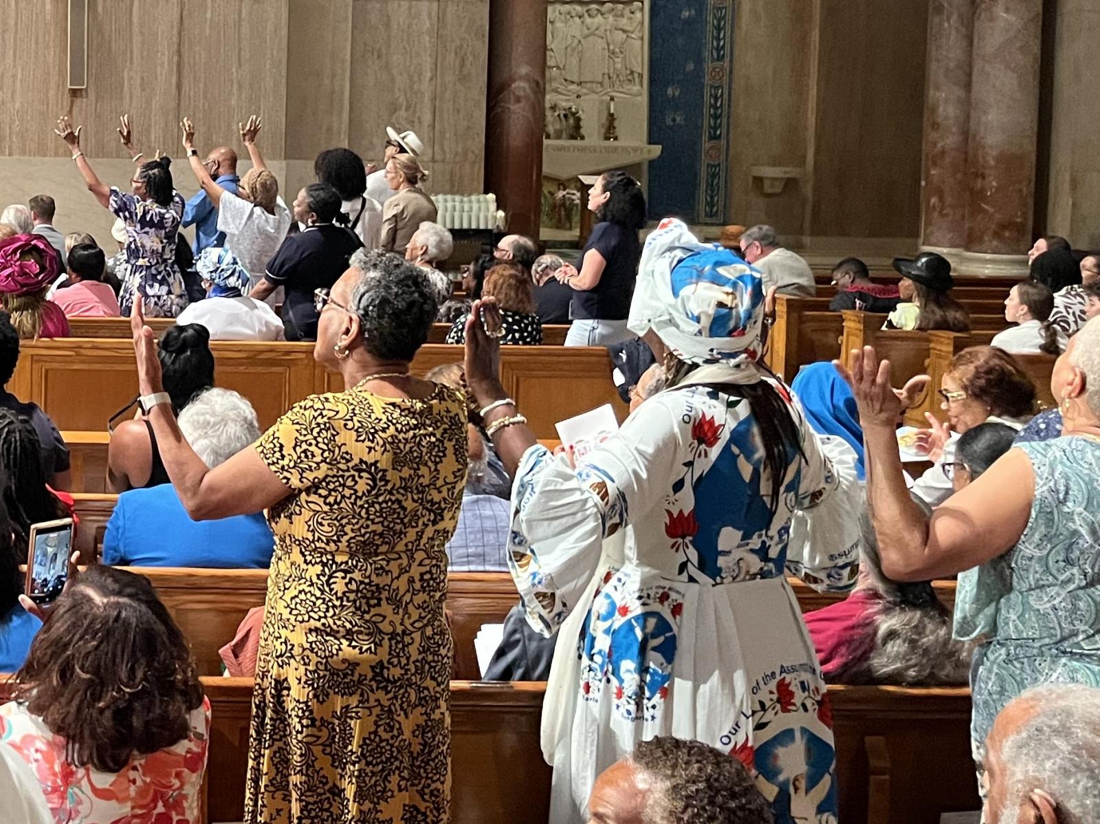 Attendees are moved by Richard Smallwood's "Total Praise" during ordination of Bishop Robert Boxie.