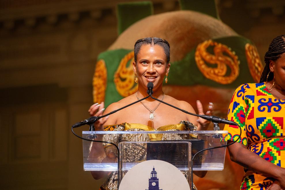 Dr. Tonija Hope, dressed in colorful Ghanian attire, at the Asantehene visit at Howard University's Cramton Auditorium