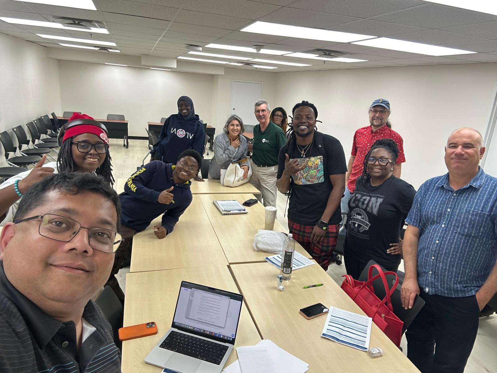 Ahmed takes selfie with participants and Lashhab